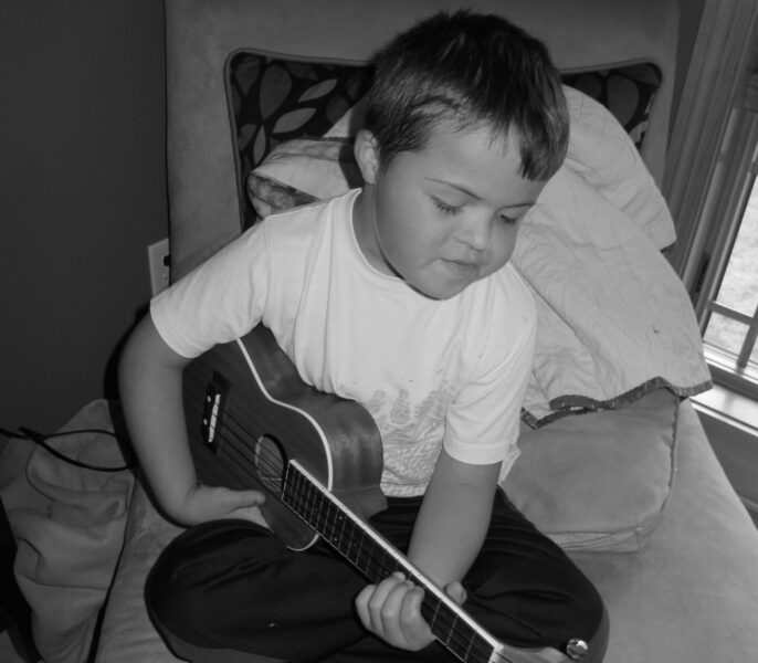 Boy playing Ukulele