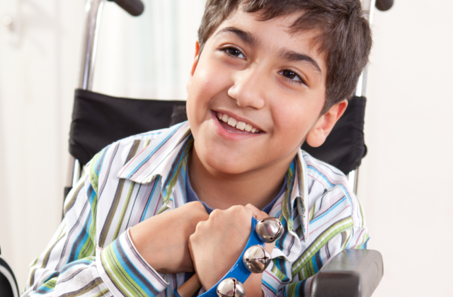 Disabled-boy-with-hand-bells